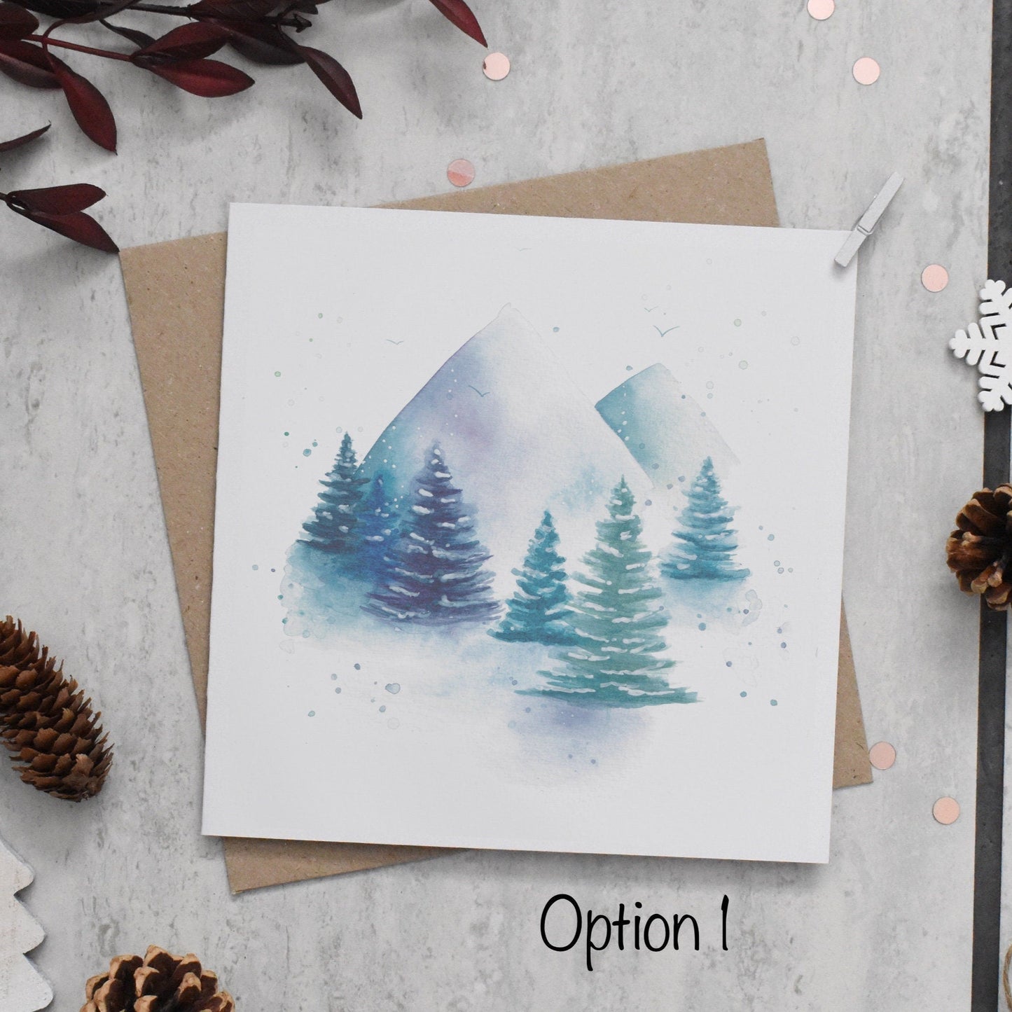 Greeting card with watercolor trees on a textured surface with decorative elements