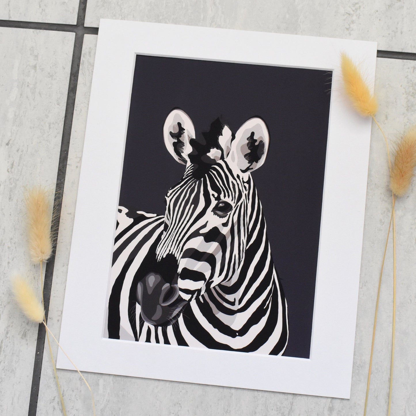 Black and white zebra illustration with decorative elements on a tiled surface.