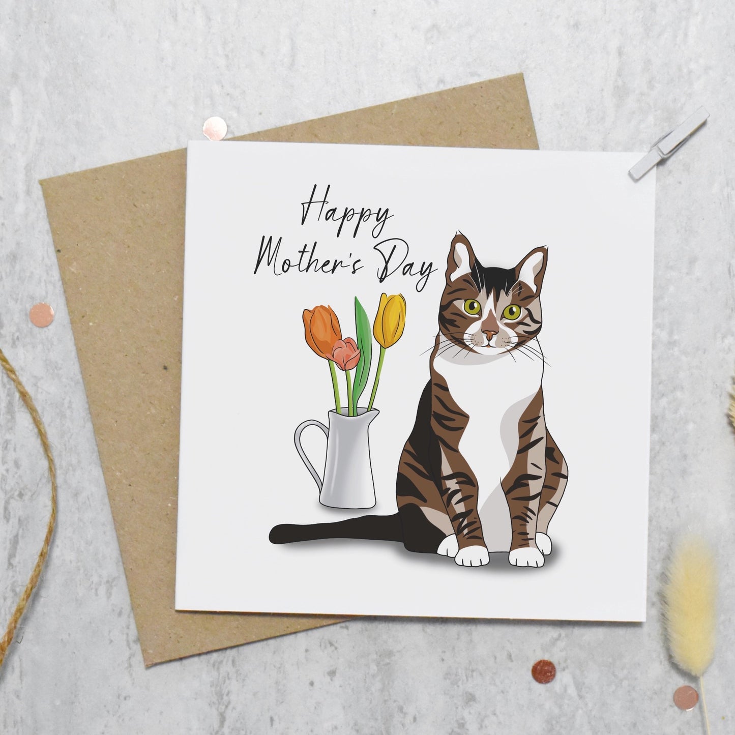 Mother's Day card with a cat and flowers on a textured surface