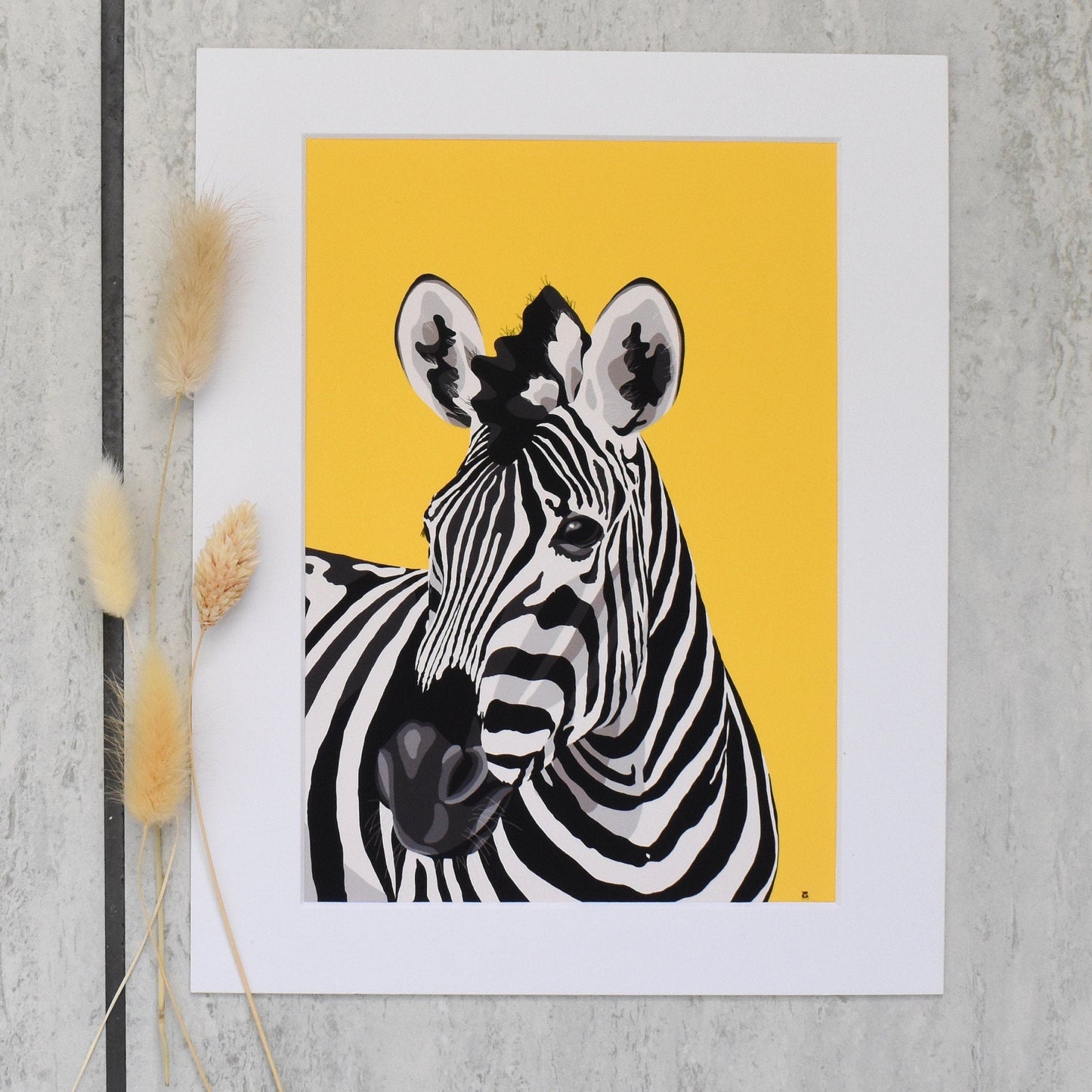 Framed artwork of a zebra on a yellow background