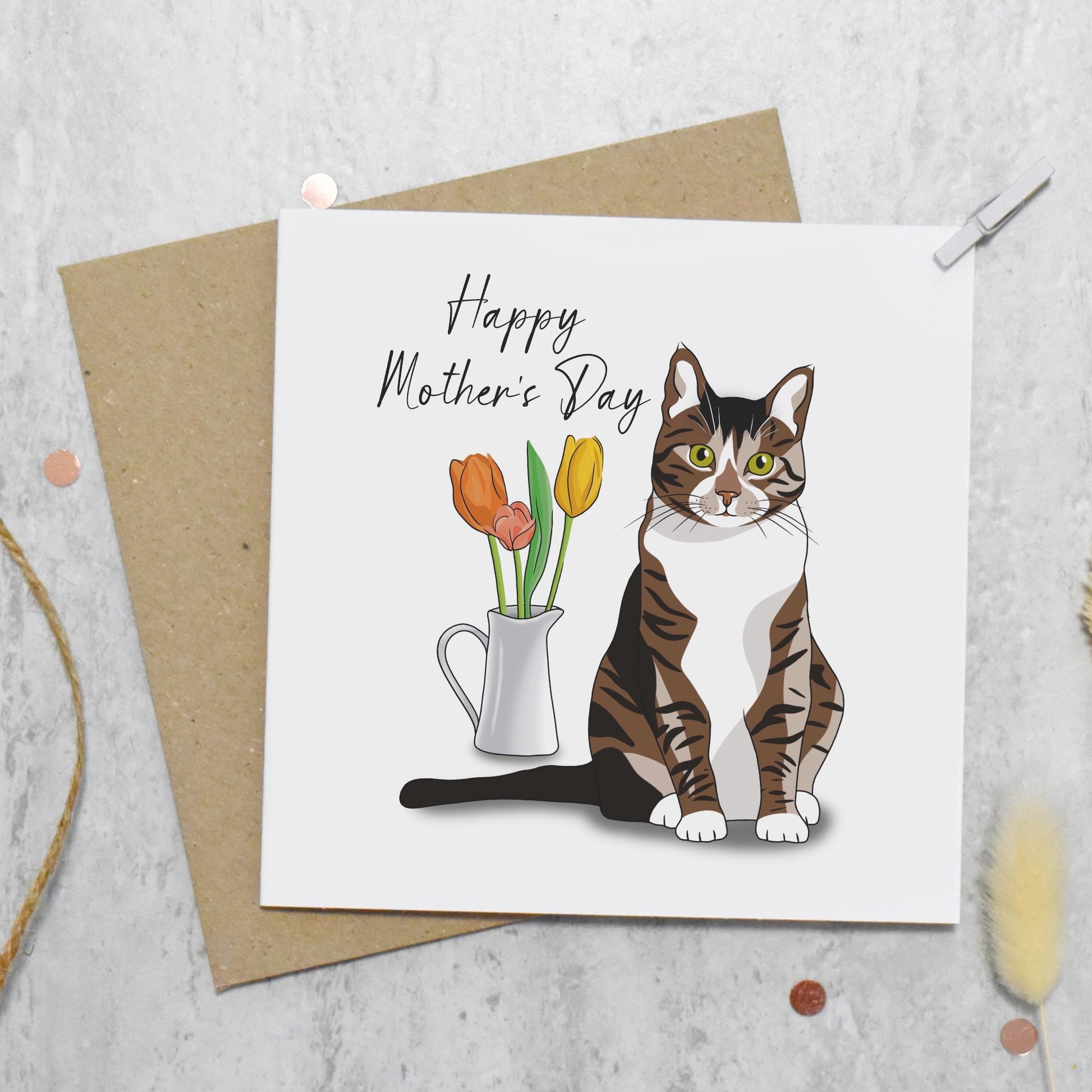 Mother's Day card with a cat and flowers on a textured surface